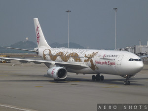 a white airplane with gold designs on it