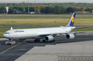 a large white airplane on a runway