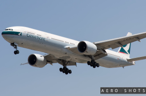 a large white airplane flying in the sky